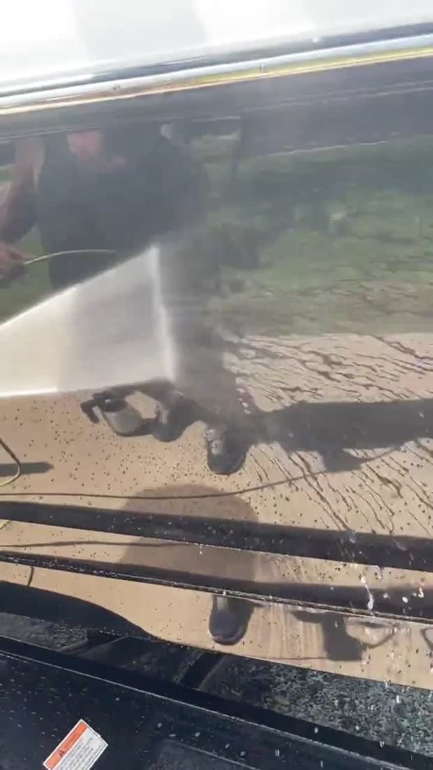 Water rinsing off a ceramic coated boat hull