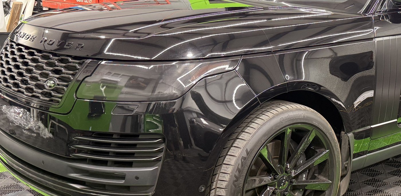 Partial front paint protection film on a Range Rover, film edge visible across the hood