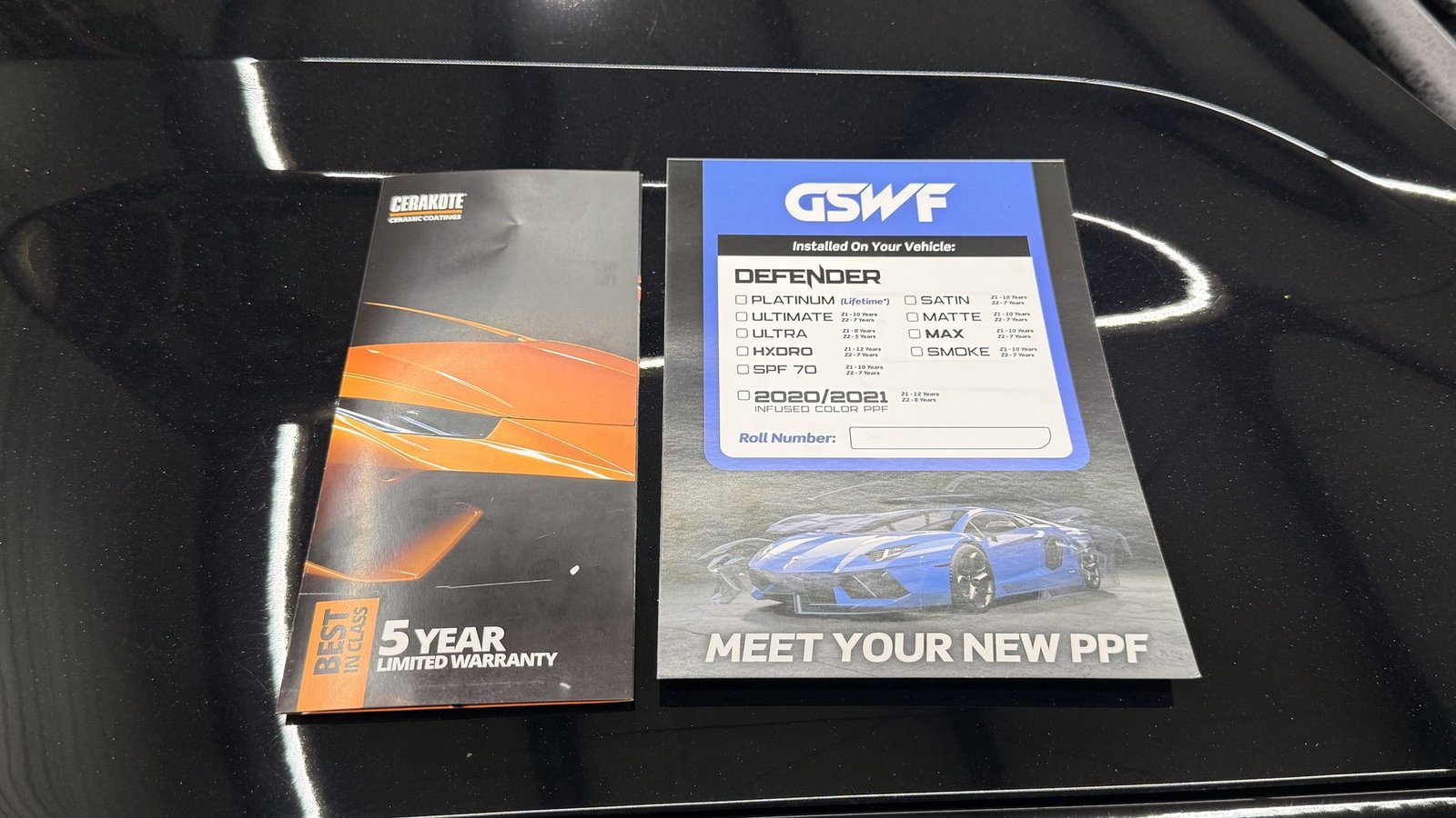 GSWF Defender and Cerakote five-year warranty documents on a ceramic coated black hood